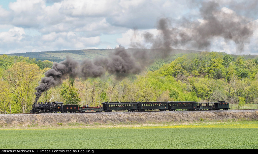 EBT 16 and excursion train southbound on the high fill